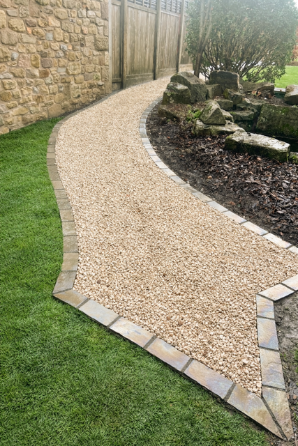 Cotswold Gravel path. edged with setts