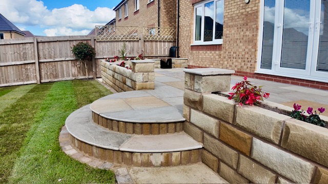 Bespoke curving sandstone steps with Yorkshire stone walling Bespoke curving sandstone steps with Yorkshire stone walling